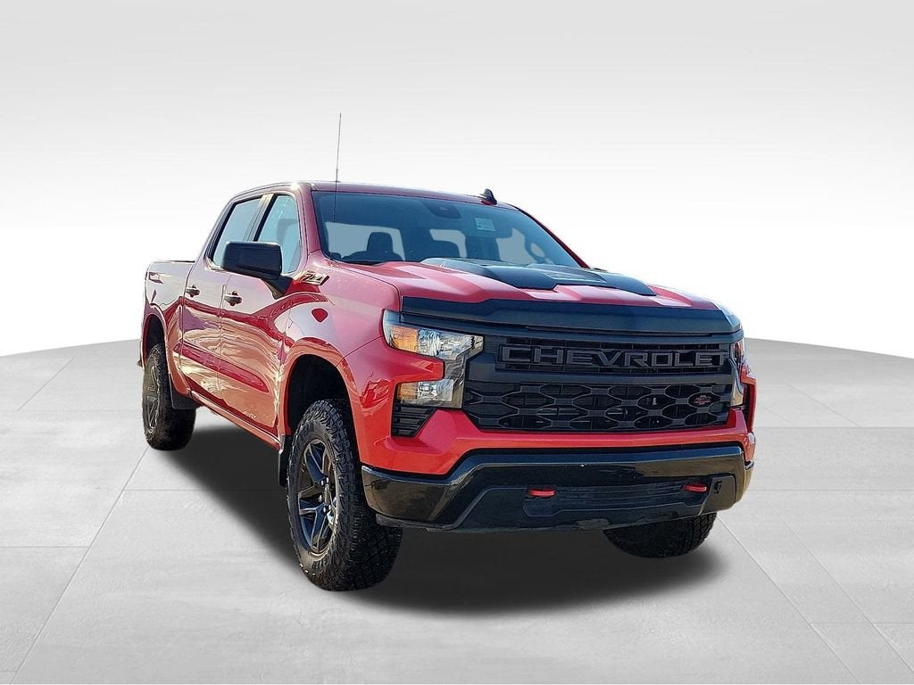 2023 Chevrolet Silverado 1500 Custom Trail Boss in Red Hot — front three-quarter view