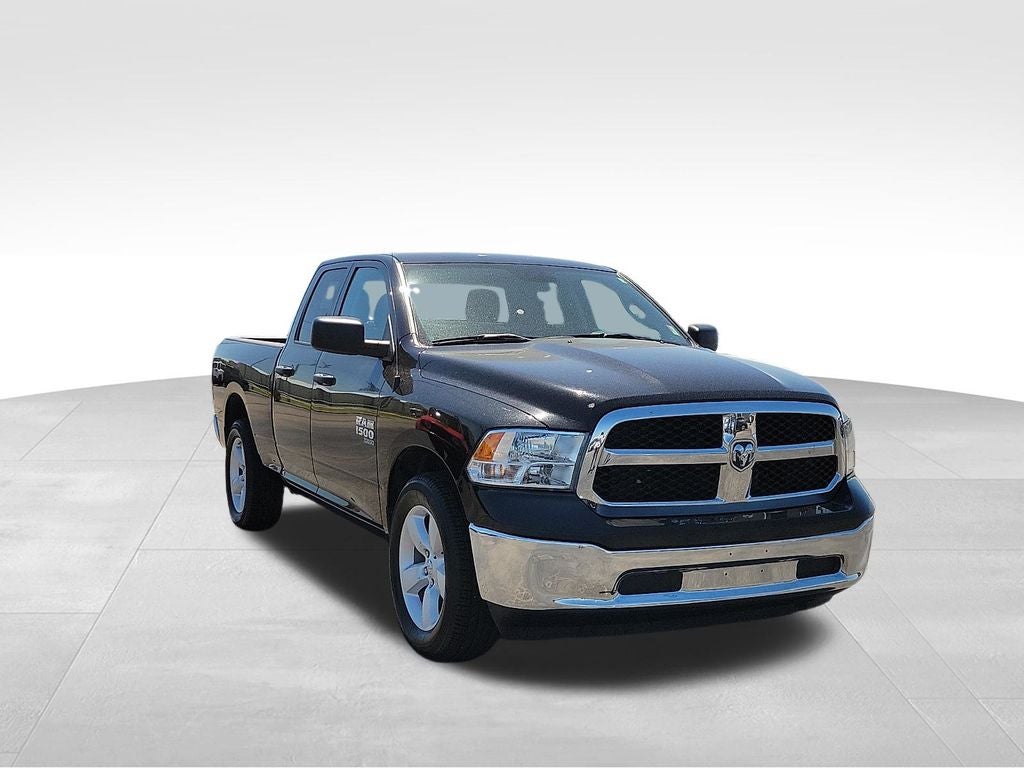 2024 RAM 1500 Classic SLT in Diamond Black Crystal Pearlcoat — front three-quarter view